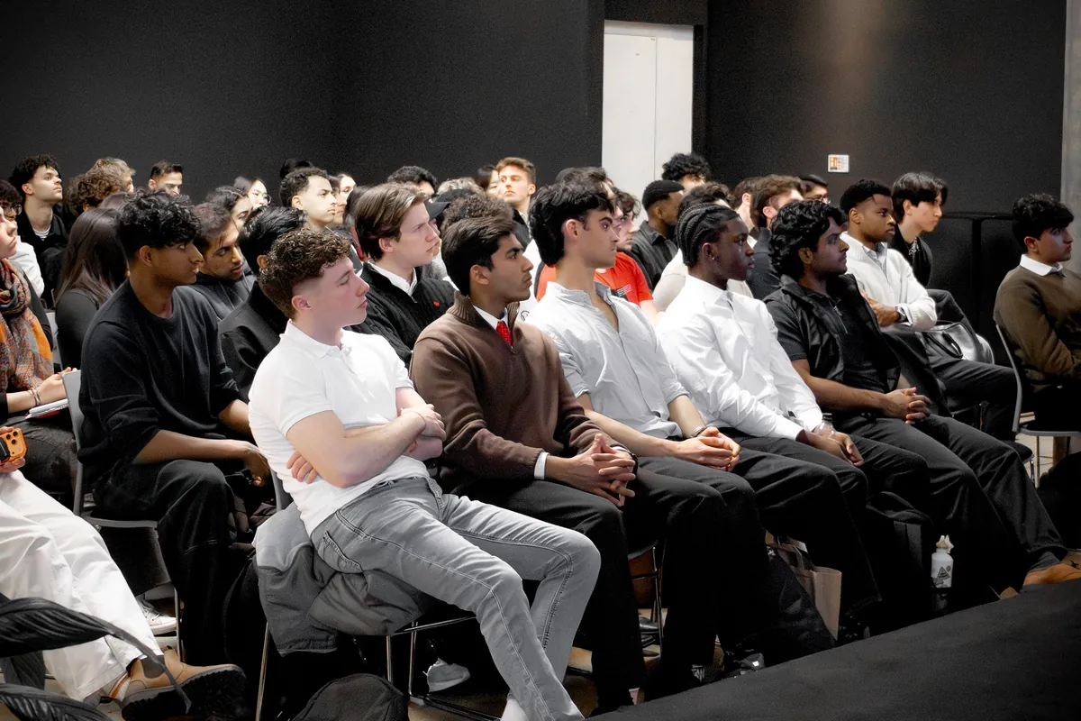 A packed room of students at the London day
